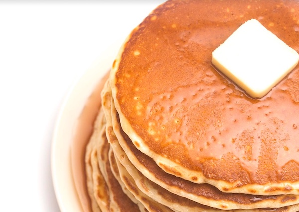 Upgrade your instant mix pancakes with a generous slab of butter on top.