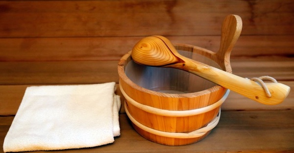 A wooden bucket with a towel.