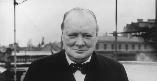 A best quotes photo of a man in a suit and tie.