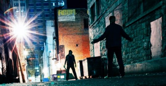 Two people standing in an alley at night, preparing themselves for any potential dangers.