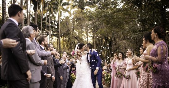 A bride and groom share a kiss at their wedding.