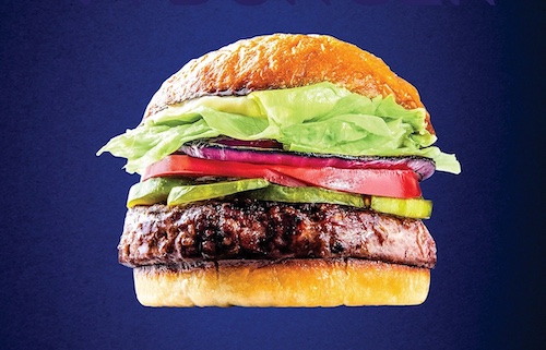 A perfect burger with lettuce and tomatoes on a blue background.