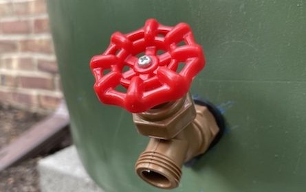 A water hose with a red nozzle can be easily installed under an hour.