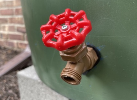 A water hose with a red nozzle can be easily installed under an hour.