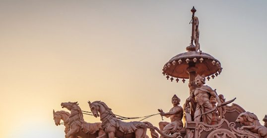 A statue of a chariot with horses on it is featured in the Bhagavad Gita.