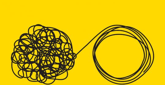 A black and white drawing of a tangled ball on a vibrant yellow background.