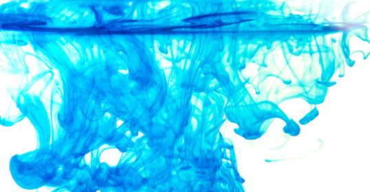 A blue liquid is poured into a glass, demonstrating the dangers of concept creep.