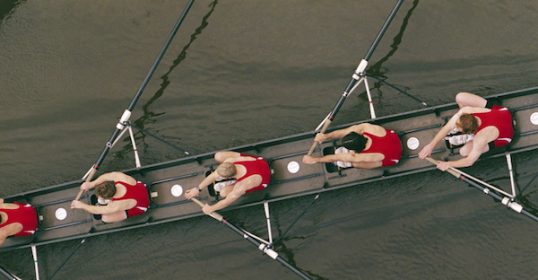 A group of allies rowing in a rowboat.