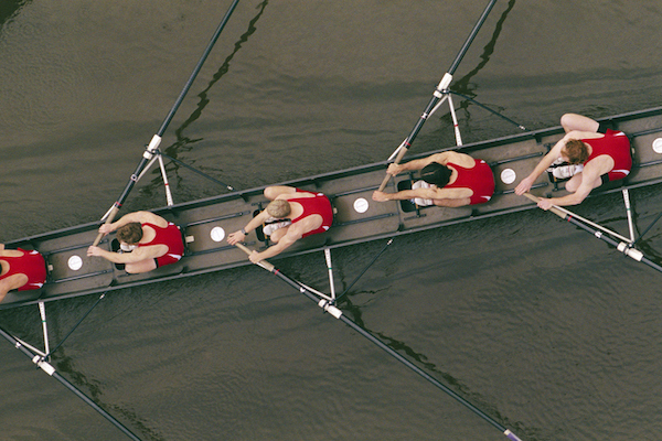 A group of allies rowing in a rowboat.