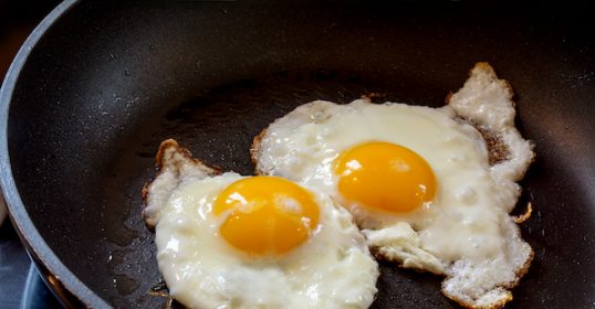 Learn how to make perfect over-hard fried eggs in a frying pan.