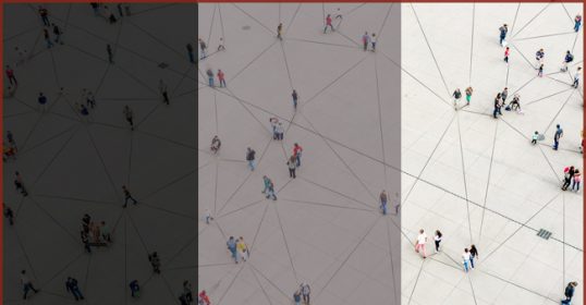 A black and white image of people walking in a square, depicting ambivalent relationships.