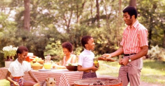 Jimmy Carter and his family enjoying a picnic in the park during the summer.