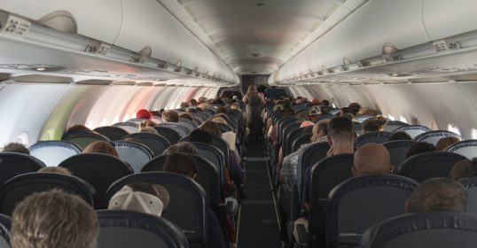 A flying vehicle full of people.