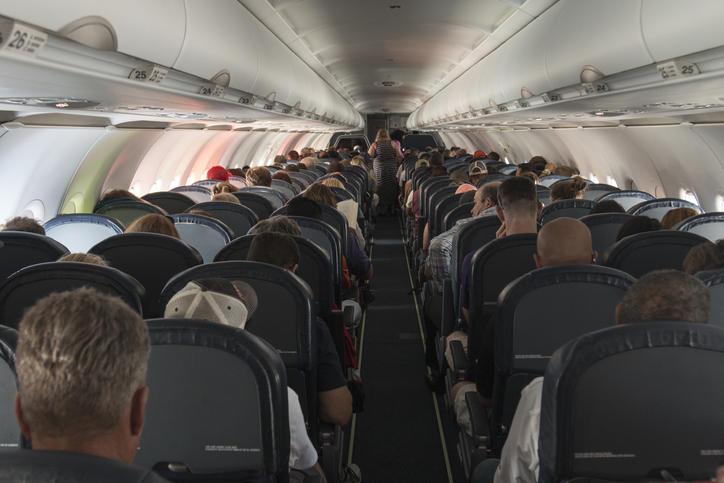 A flying vehicle full of people.