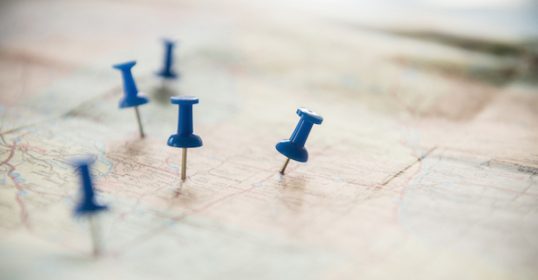 Blue pins on a map can be accessed anywhere.