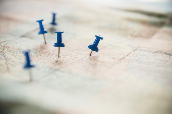 Blue pins on a map can be accessed anywhere.