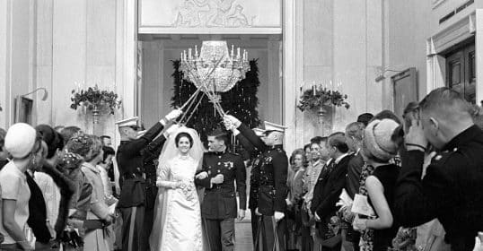 A bride and groom walk down the aisle at the white house, creating a powerful ritual.