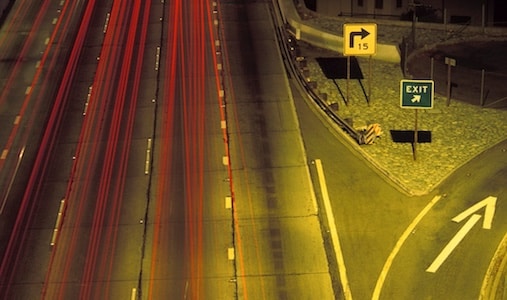 An aerial view of a busy highway at night.
