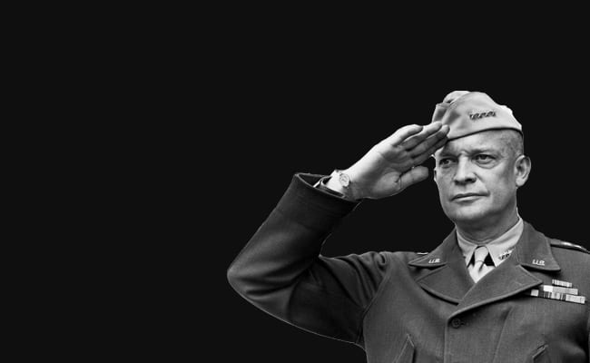 Military officer saluting on a black background, embodying personal discipline.