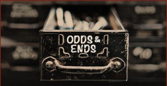 Odds and ends - a black and white image of a drawer with a sign that reads 'odds & ends'.