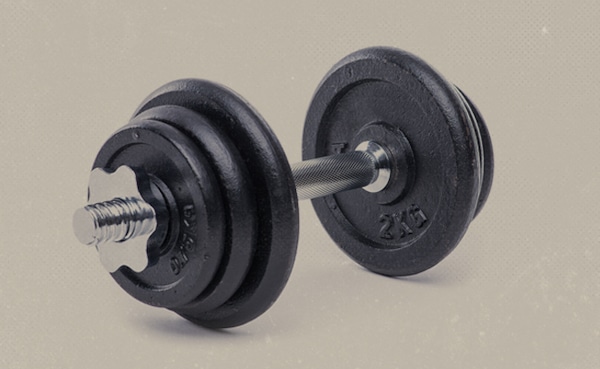 Adjustable dumbbell, called a "dumbbell" for historical reasons, with weight plates on a textured background.