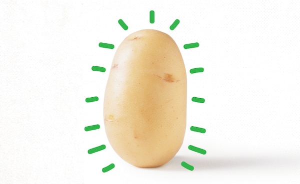 A raw potato with green lines radiating outward to suggest the health benefits or energy associated with it.