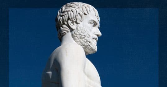 Marble statue of a living bearded male figure against a blue sky background, embodying Aristotle's Excellences.