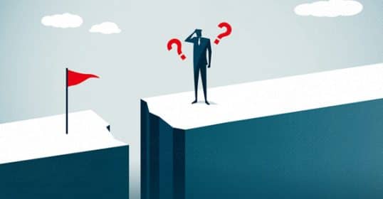 A conceptual illustration of a person standing at the edge of a cliff, facing a gap with goal disengagement on the other side, symbolizing challenge and uncertainty.