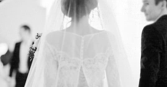 Bride and groom in a soft focus marriage photograph.