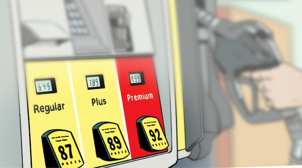 A person is filling up their car at a gas station with options for regular, plus, and premium Gas Octanes visible on the pump.