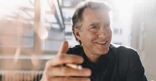 A man holding a cigarette, secrets.