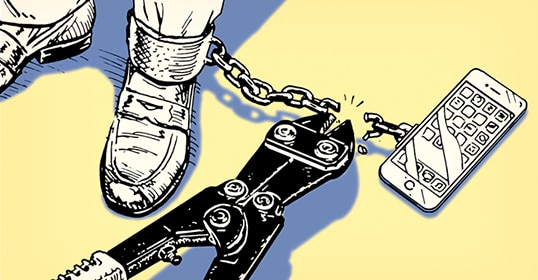 Illustration of a leg shackled to a distraction-free phone depicting addiction, with the chain broken by bolt cutters.