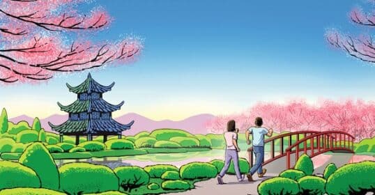 Two people practicing 3X3 Interval Walking towards a traditional Asian pagoda, crossing a red bridge in a lush park with blooming pink trees.