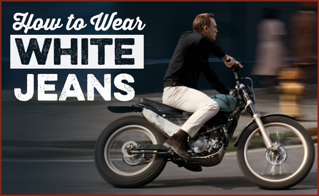 Man riding a motorcycle wearing white jeans with text overlay "how to pull off white jeans.