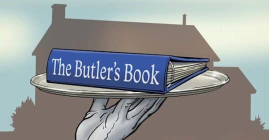 a hand holding a book on a tray