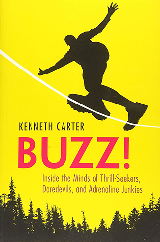 Silhouette of a person jumping on a yellow book cover with trees at the bottom. Title: "BUZZ!" by Kenneth Carter. Subheading reads: "Inside the Minds of Thrill-Seekers, Daredevils, and Adrenaline Junkies.