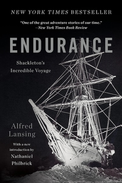 The cover of "Endurance: Shackleton's Incredible Voyage" by Alfred Lansing, an ideal gift for history book enthusiasts, showcases a black and white photo of a ship trapped in ice. The text highlights its bestseller status and praise, making it a perfect addition to any Christmas reading list.