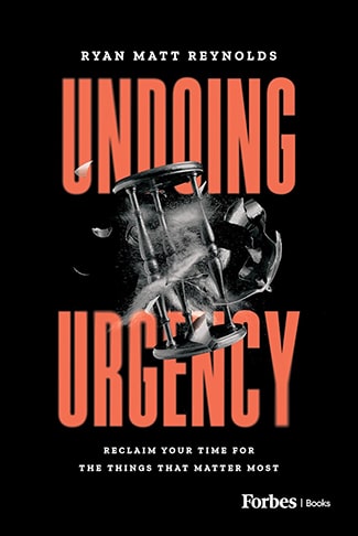 The book cover of "Undoing Urgency" by Ryan Matt Reynolds features large red text and an image of a shattering clock against a black background, subtly emphasizing living with purpose amidst chaos.